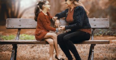 mother and daughter on bench - how to use a behavior chart