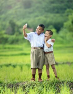two boys with cell phone - guide for christian parents